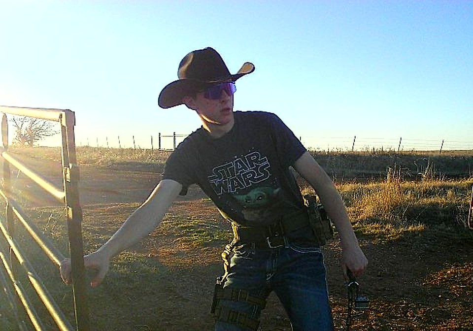 John Luke Spivey working a gate at golden hour